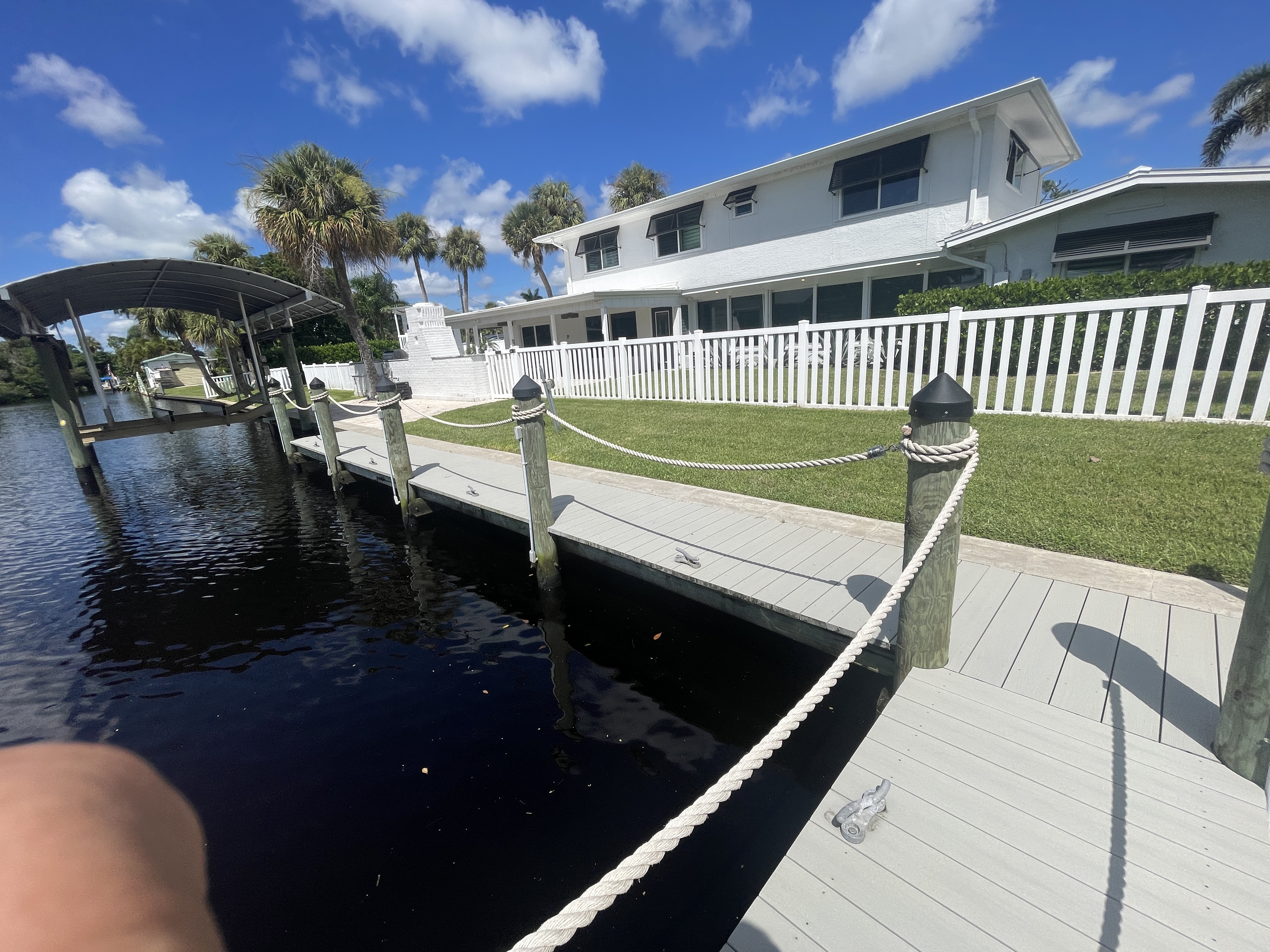 Aerial view of OceanTimes property with pool and boat dock
