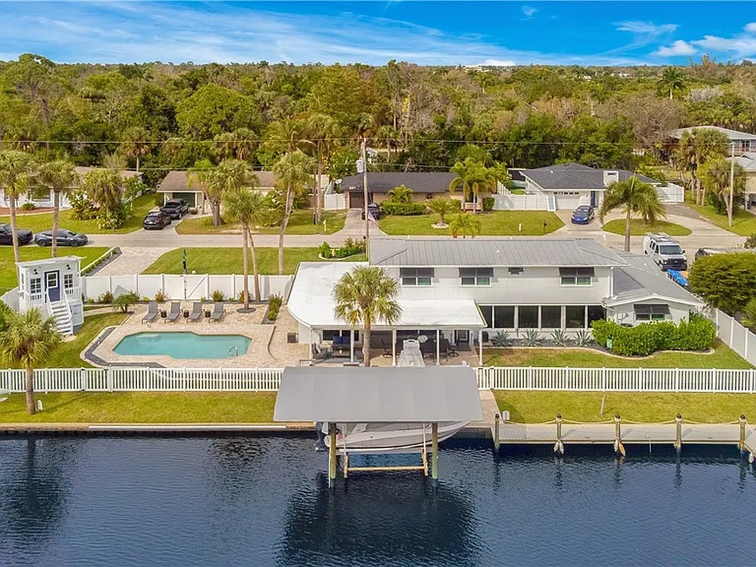Aerial of OceanTimes showing the private dock, boat lift and canal in Fort Myers