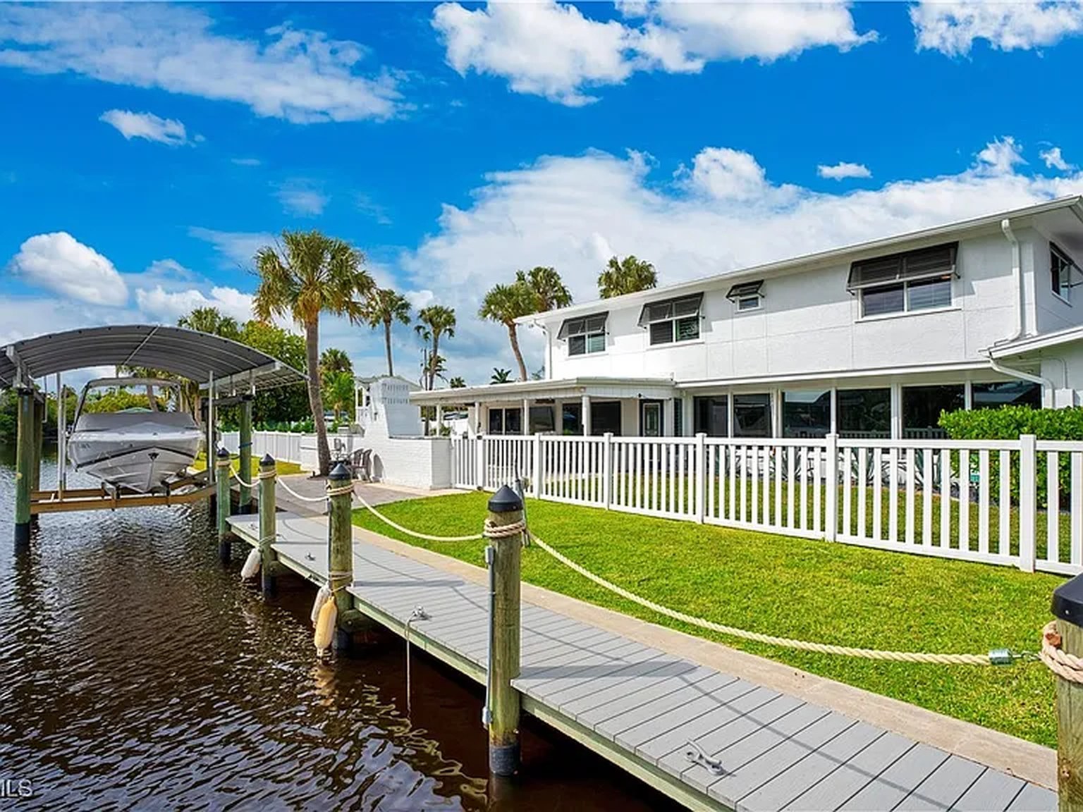 Private boat dock and lift at OceanTimes in Fort Myers, the Tarpon Capital of the World