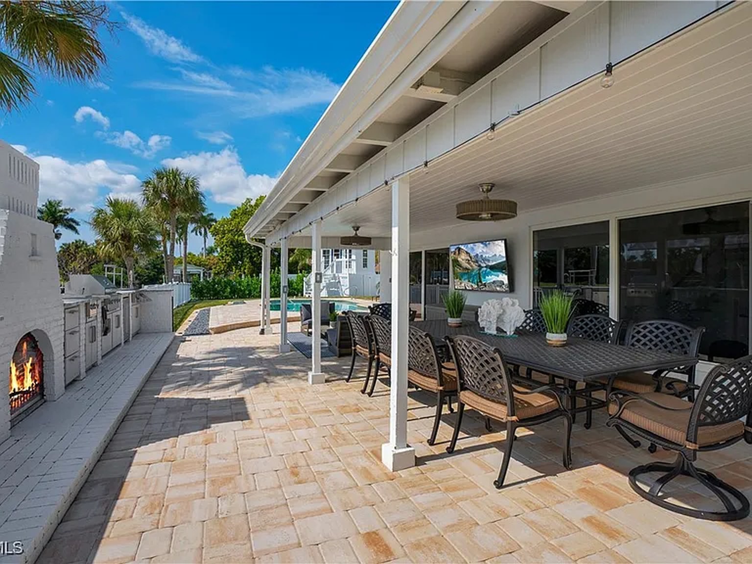 Covered waterfront patio at OceanTimes, ideal for corporate retreats in Fort Myers