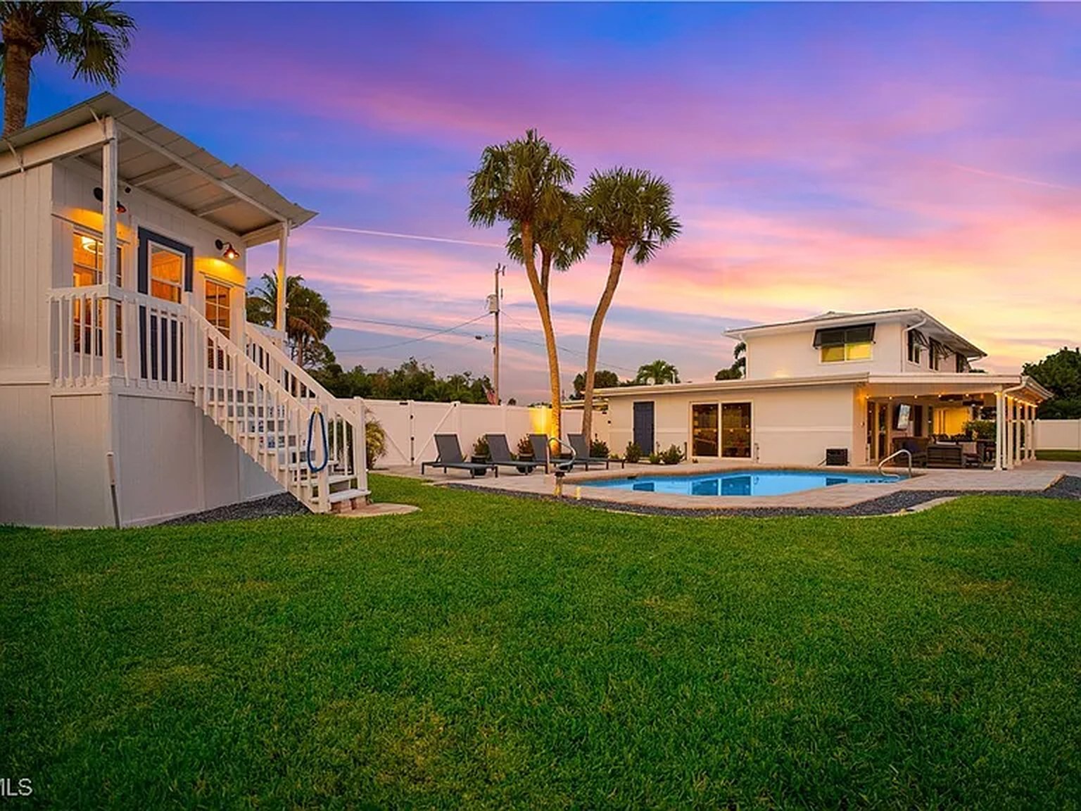 Pool and waterfront at OceanTimes at sunset, a Fort Myers wedding-weekend rental